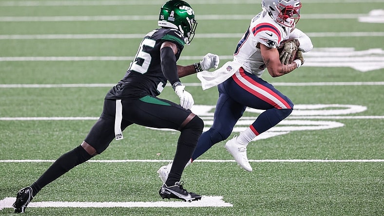 Nov 9, 2020; East Rutherford, New Jersey, USA; New England Patriots wide receiver Damiere Byrd (10) gains yards after the catch as New York Jets cornerback Pierre Desir (35) pursues during the second half at MetLife Stadium. Mandatory Credit: Vincent Carchietta-USA TODAY Sports
