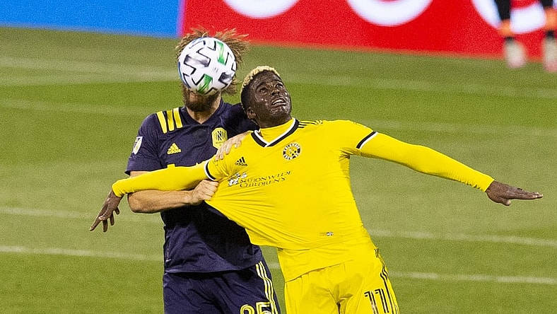 Nov 29, 2020; Columbus, Ohio, USA; Columbus Crew SC forward Gyasi Zardes (11) has his jersey pulled by Nashville SC defender Walker Zimmerman (25) in the first half at MAPFRE Stadium. Mandatory Credit: Greg Bartram-USA TODAY Sports