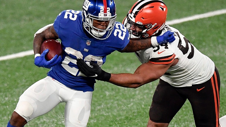 New York Giants running back Wayne Gallman (22) stiff-arms Cleveland Browns defensive end Olivier Vernon (54) in the second half. The Giants lose to the Browns, 20-6, at MetLife Stadium on Sunday, December 20, 2020, in East Rutherford.
Nyg Vs Cle
