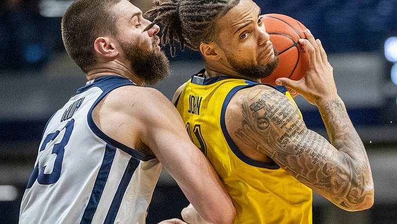 Butler Bulldogs forward Bryce Golden (33) defends Marquette Golden Eagles forward Theo John (4), Wednesday, Feb. 17, 2021, during Marquette at Butler men's basketball from Hinkle Fieldhouse, Indianapolis. Marquette won 73-57.

Butler Takes On Marquette In Men S Hoops