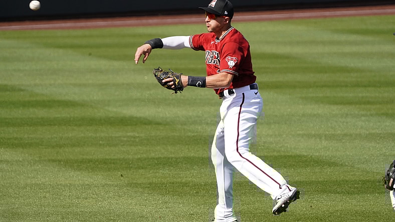 Mar 4, 2021; Salt River Pima-Maricopa, Arizona, USA; Arizona Diamondbacks shortstop Nick Ahmed (13) makes the play for an out against the Los Angeles Angels during a spring training game at Salt River Fields at Talking Stick. Mandatory Credit: Rick Scuteri-USA TODAY Sports