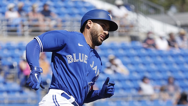 Mar 11, 2021; Dunedin, Florida, USA;  Toronto Blue Jays center fielder George Springer (4) hits a home run during the first inning against the Detroit Tigers during spring training at TD Ballpark. Mandatory Credit: Kim Klement-USA TODAY Sports