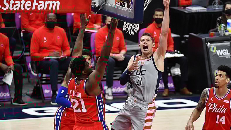 Mar 12, 2021; Washington, District of Columbia, USA; Washington Wizards center Moritz Wagner (21) shoots over Philadelphia 76ers center Joel Embiid (21) during the first quarter at Capital One Arena. Mandatory Credit: Brad Mills-USA TODAY Sports
