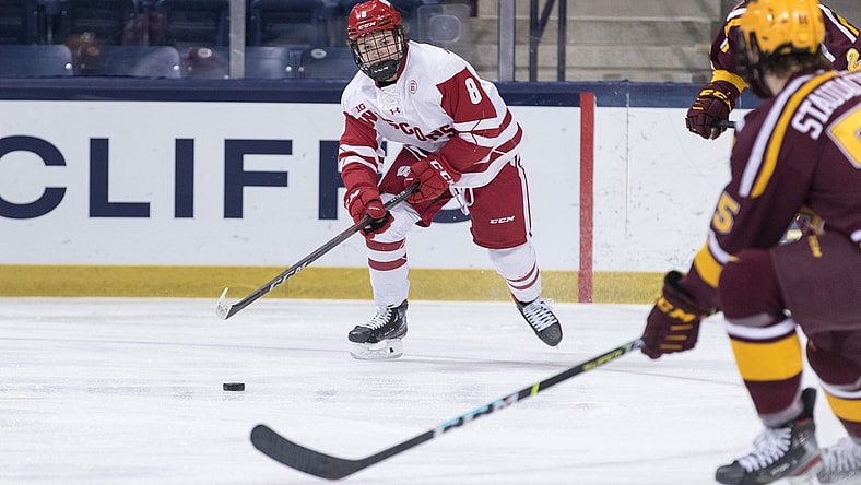 March 16, 2021; South Bend, IN, USA; Wisconsin Badgers forward Cole Caufield (8) advances the puck against the Minnesota Golden Gophers during the Big Ten hockey tournament championship game at Compton Family Ice Arena. Mandatory Credit: John Mersits/South Bend Tribune via USA TODAY NETWORK
