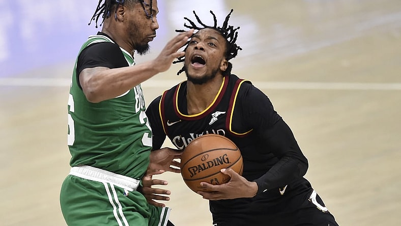 Mar 17, 2021; Cleveland, Ohio, USA; Boston Celtics guard Marcus Smart (36) defends Cleveland Cavaliers guard Darius Garland (10) in the third quarter at Rocket Mortgage FieldHouse. Mandatory Credit: David Richard-USA TODAY Sports