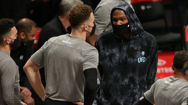 Mar 21, 2021; Brooklyn, New York, USA; Brooklyn Nets power forward Kevin Durant (7) talks to power forward Blake Griffin (2) during the fourth quarter against the Washington Wizards at Barclays Center. Mandatory Credit: Brad Penner-USA TODAY Sports