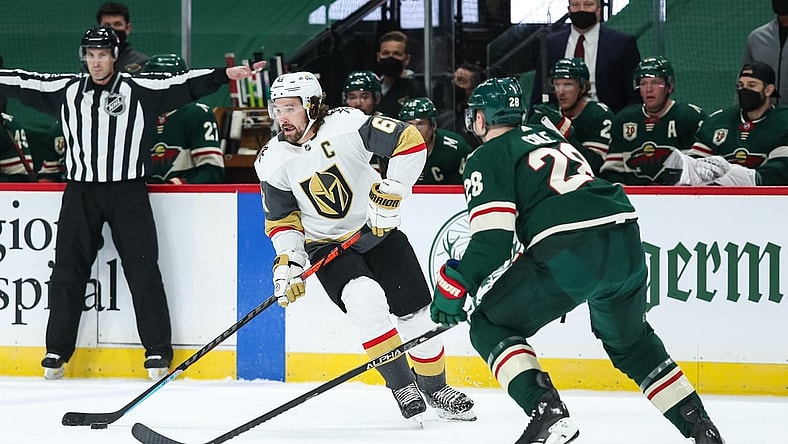 Mar 10, 2021; Saint Paul, Minnesota, USA; Vegas Golden Knights right wing Mark Stone (61) skates with the puck while Minnesota Wild defenseman Ian Cole (28) defends in the first period at Xcel Energy Center. Mandatory Credit: David Berding-USA TODAY Sports