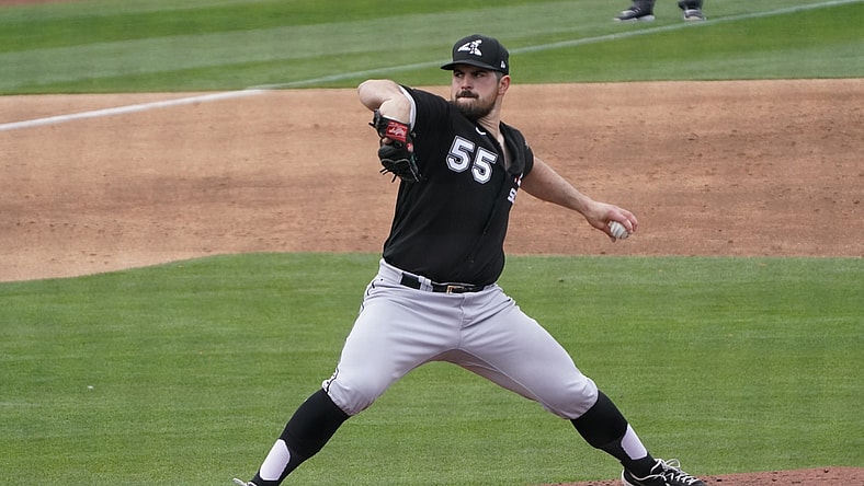 Mar 26, 2021; Phoenix, Arizona, USA; Chicago White Sox starting pitcher Carlos Rodon (55) throws against the Milwaukee Brewers during a spring training game at American Family Fields of Phoenix. Mandatory Credit: Rick Scuteri-USA TODAY Sports