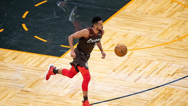 Mar 26, 2021; Orlando, Florida, USA; Portland Trail Blazers guard CJ McCollum (3) dribbles against the Orlando Magic during the first quarter at Amway Center. Mandatory Credit: Mary Holt-USA TODAY Sports
