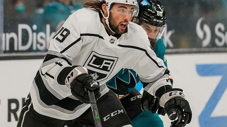 Mar 24, 2021; San Jose, California, USA;  Los Angeles Kings right wing Alex Iafallo (19) chases after the puck during the first period against the San Jose Sharks at SAP Center at San Jose. Mandatory Credit: Stan Szeto-USA TODAY Sports