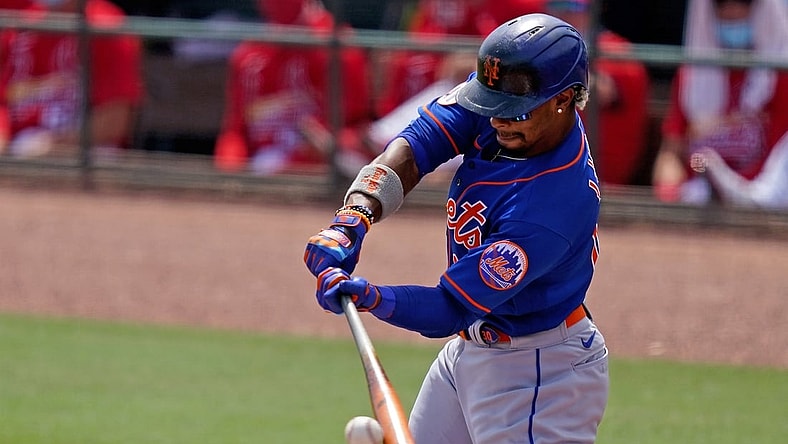 Mar 29, 2021; Jupiter, Florida, USA; New York Mets shortstop Francisco Lindor (12) doubles in the 1st inning of the spring training game against the St. Louis Cardinals at Roger Dean Chevrolet Stadium. Mandatory Credit: Jasen Vinlove-USA TODAY Sports