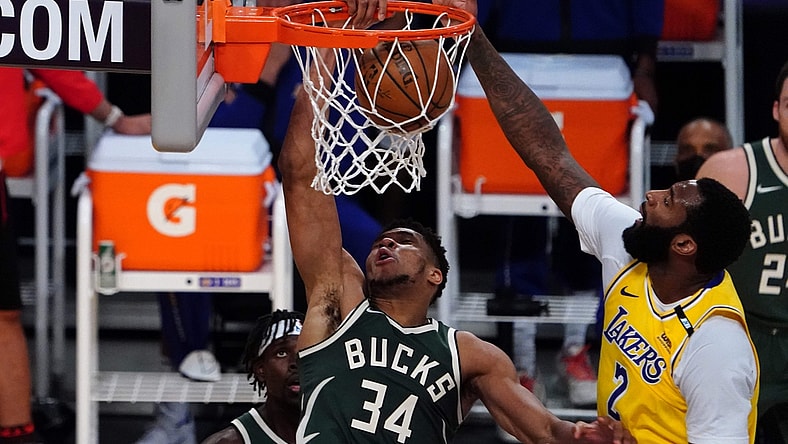 Mar 31, 2021; Los Angeles, California, USA; Milwaukee Bucks forward Giannis Antetokounmpo (34) dunks the ball against Los Angeles Lakers center Andre Drummond (2) during the first half at Staples Center. Mandatory Credit: Kirby Lee-USA TODAY Sports