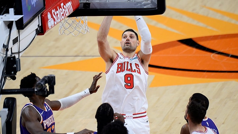 Mar 31, 2021; Phoenix, Arizona, USA; Chicago Bulls center Nikola Vucevic (9) shoots against the Phoenix Suns during the second half at Phoenix Suns Arena. Mandatory Credit: Joe Camporeale-USA TODAY Sports