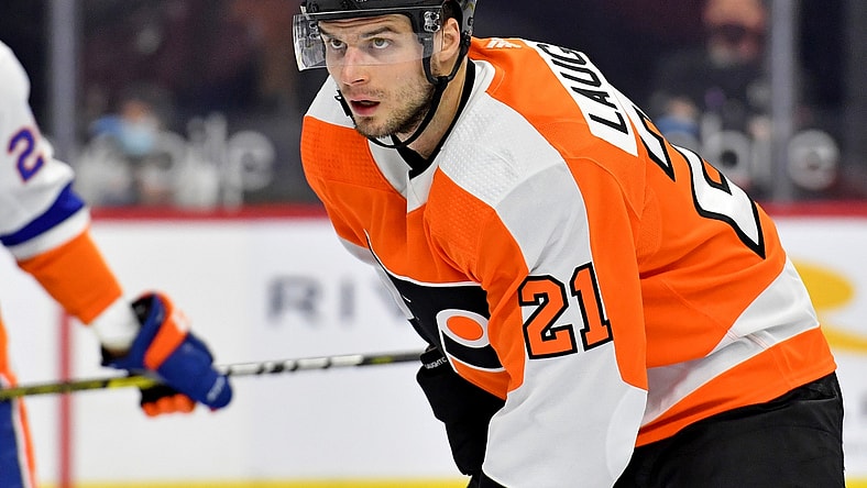 Mar 22, 2021; Philadelphia, Pennsylvania, USA; Philadelphia Flyers left wing Scott Laughton (21) against the New York Islanders at Wells Fargo Center. Mandatory Credit: Eric Hartline-USA TODAY Sports