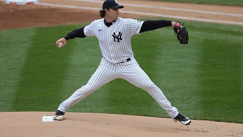 Apr 1, 2021; Bronx, New York, USA; New York Yankees starting pitcher Gerrit Cole (45) pitches against the Toronto Blue Jays during the first inning of an opening day game at Yankee Stadium. Mandatory Credit: Brad Penner-USA TODAY Sports