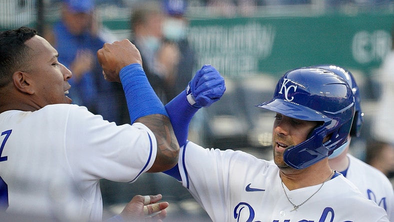 Apr 1, 2021; Kansas City, Missouri, USA; Kansas City Royals right fielder Whit Merrifield (15) celebrates with catcher Salvador Perez (13) after hitting a solo home run in the eighth inning against the Texas Rangers at Kauffman Stadium. Mandatory Credit: Denny Medley-USA TODAY Sports