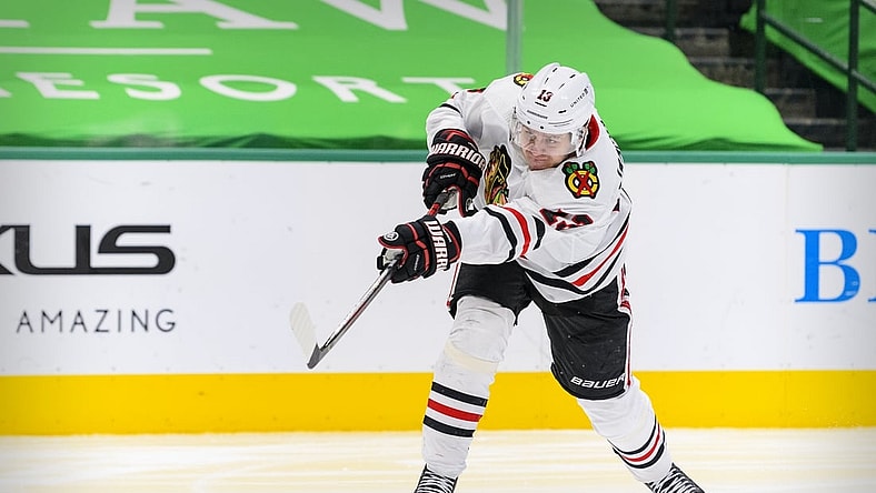 Mar 11, 2021; Dallas, Texas, USA; Chicago Blackhawks center Mattias Janmark (13) in action during the game between the Dallas Stars and the Chicago Blackhawks at the American Airlines Center. Mandatory Credit: Jerome Miron-USA TODAY Sports
