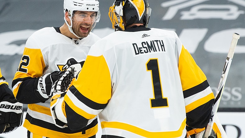 Apr 1, 2021; Boston, Massachusetts, USA; Pittsburgh Penguins forward Zach Aston-Reese the (12)  celebrates with goaltender Casey DeSmith (1) after getting a win against the Boston Bruins at TD Garden. Mandatory Credit: Kathryn Riley-USA TODAY Sports