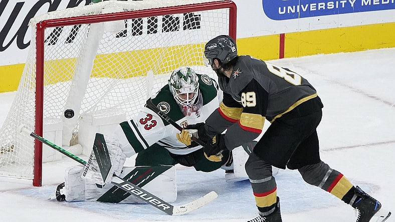 Apr 1, 2021; Las Vegas, Nevada, USA; Vegas Golden Knights right wing Alex Tuch (89) misses a shot on Minnesota Wild goaltender Cam Talbot (33) in a shootout  at T-Mobile Arena. Mandatory Credit: John Locher/The Associated Press via USA TODAY Network )