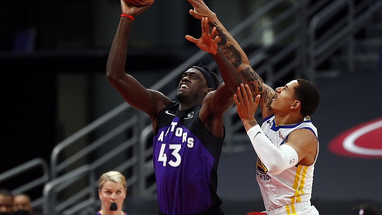 Apr 2, 2021; Tampa, Florida, USA; Toronto Raptors forward Pascal Siakam (43) shoots as Golden State Warriors forward Juan Toscano-Anderson (95) attempts to defend during the first half at Amalie Arena. Mandatory Credit: Kim Klement-USA TODAY Sports