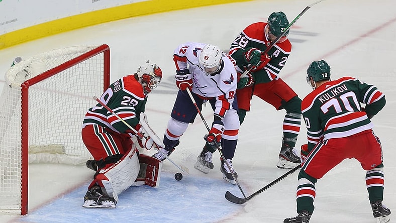 Apr 2, 2021; Newark, New Jersey, USA; New Jersey Devils goaltender Mackenzie Blackwood (29) makes a save on Washington Capitals center Evgeny Kuznetsov (92) during the second period at Prudential Center. Mandatory Credit: Ed Mulholland-USA TODAY Sports