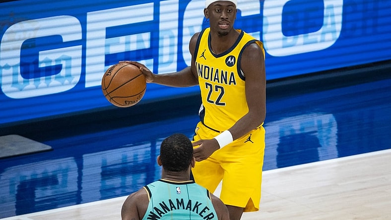 Apr 2, 2021; Indianapolis, Indiana, USA; Indiana Pacers guard Caris LeVert (22) dribbles the ball while Charlotte Hornets guard Brad Wanamaker (9) defends  in the second quarter at Bankers Life Fieldhouse. Mandatory Credit: Trevor Ruszkowski-USA TODAY Sports