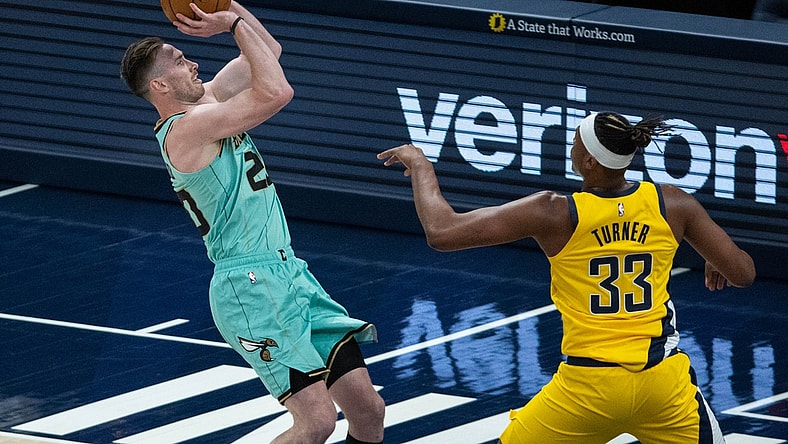 Apr 2, 2021; Indianapolis, Indiana, USA; Charlotte Hornets forward Gordon Hayward (20) shoots the ball while Indiana Pacers center Myles Turner (33) defends in the second quarter at Bankers Life Fieldhouse. Mandatory Credit: Trevor Ruszkowski-USA TODAY Sports