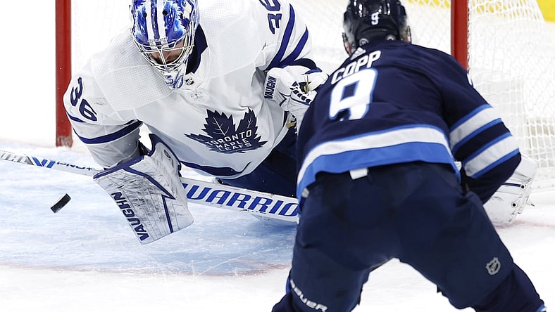 Apr 2, 2021; Winnipeg, Manitoba, CAN;  Winnipeg Jets center Andrew Copp (9) scores on Toronto Maple Leafs goaltender Jack Campbell (36) in the second period at Bell MTS Place. Mandatory Credit: James Carey Lauder-USA TODAY Sports