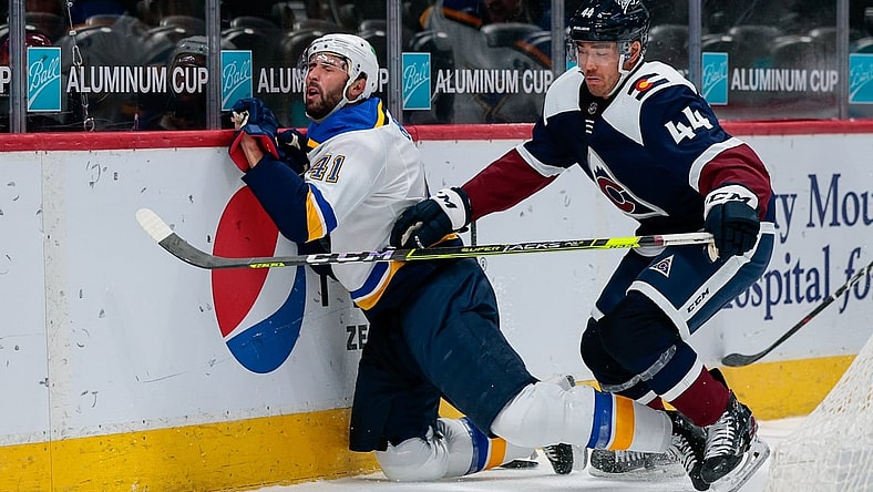 Apr 2, 2021; Denver, Colorado, USA; Colorado Avalanche left wing Kiefer Sherwood (44) checks St. Louis Blues defenseman Robert Bortuzzo (41) in the third period at Ball Arena. Mandatory Credit: Isaiah J. Downing-USA TODAY Sports