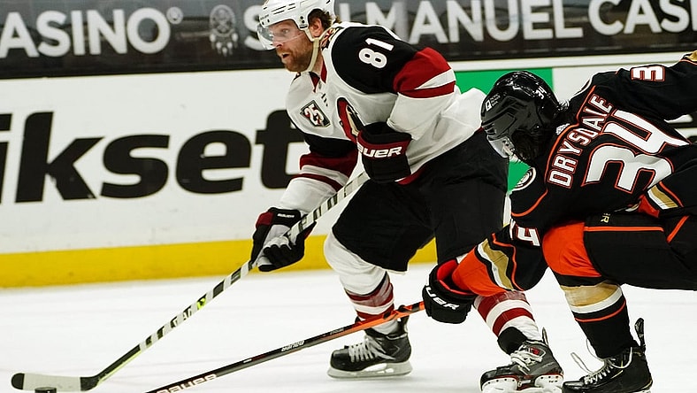 Apr 2, 2021; Anaheim, California, USA; Arizona Coyotes right wing Phil Kessel (81) moves in for a shot on goal ahead of Anaheim Ducks defenseman Jamie Drysdale (34) during the third period at Honda Center. Mandatory Credit: Gary A. Vasquez-USA TODAY Sports