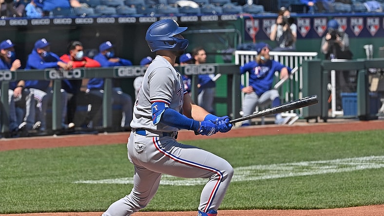 Apr 3, 2021; Kansas City, Missouri, USA; Texas Rangers right fielder Joey Gallo (13) hits a two run home run during the first inning against the Kansas City Royals at Kauffman Stadium. Mandatory Credit: Peter Aiken-USA TODAY Sports