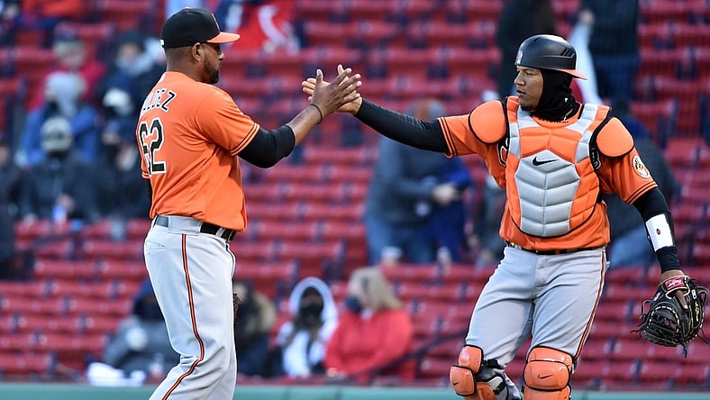 Apr 3, 2021; Boston, Massachusetts, USA; Baltimore Orioles relief pitcher Cesar Valdez (62) is congratulated by catcher Pedro Severino (28) after defeating the Boston Red Sox at Fenway Park. Mandatory Credit: Bob DeChiara-USA TODAY Sports