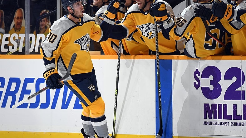Apr 3, 2021; Nashville, Tennessee, USA; Nashville Predators center Colton Sissons (10) celebrates with teammates after scoring on a penalty shot during the second period against the Chicago Blackhawks at Bridgestone Arena. Mandatory Credit: Christopher Hanewinckel-USA TODAY Sports