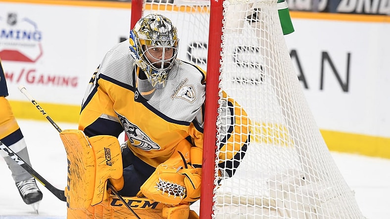 Apr 3, 2021; Nashville, Tennessee, USA; Nashville Predators goaltender Juuse Saros (74) watches the puck in the corner during the second period against the Chicago Blackhawks at Bridgestone Arena. Mandatory Credit: Christopher Hanewinckel-USA TODAY Sports