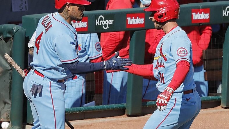 Apr 3, 2021; Cincinnati, Ohio, USA; St. Louis Cardinals shortstop Paul DeJong (11) reacts with catcher Yadier Molina (4) after hitting a solo home run against the Cincinnati Reds during the second inning at Great American Ball Park. Mandatory Credit: David Kohl-USA TODAY Sports