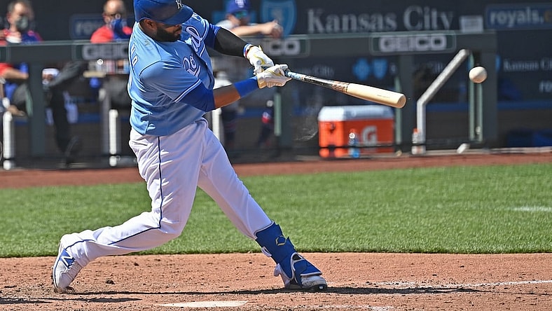 Apr 3, 2021; Kansas City, Missouri, USA; Kansas City Royals first baseman Carlos Santana (41) doubles in two runs during the sixth inning against the Texas Rangers at Kauffman Stadium. Mandatory Credit: Peter Aiken-USA TODAY Sports