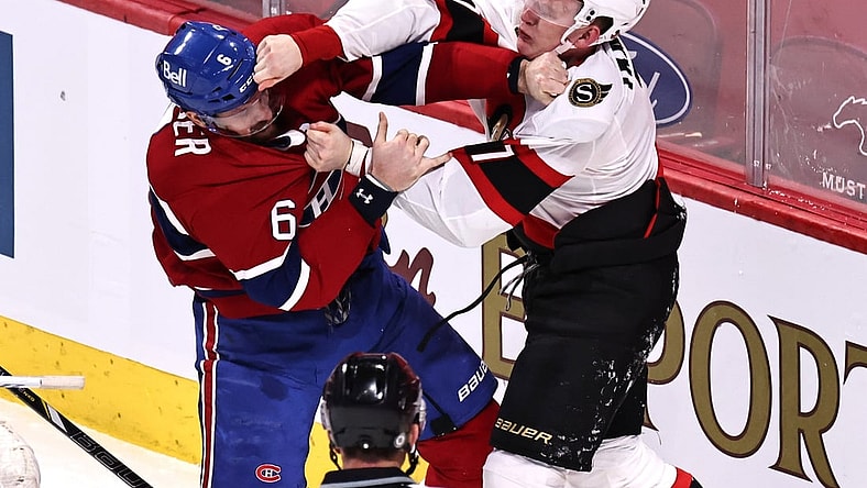 Apr 3, 2021; Montreal, Quebec, CAN; Montreal Canadiens defenseman Shea Weber (6) and Ottawa Senators left wing Brady Tkachuk (7) fight during the first period at Bell Centre. Mandatory Credit: Jean-Yves Ahern-USA TODAY Sports