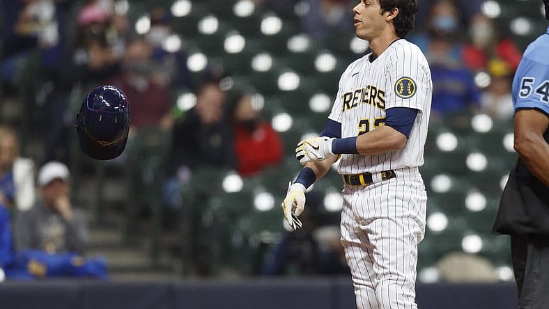 Apr 3, 2021; Milwaukee, Wisconsin, USA;  Milwaukee Brewers left fielder Christian Yelich (22) tosses his helmet after striking out against the Minnesota Twins during the fourth inning at American Family Field. Mandatory Credit: Jeff Hanisch-USA TODAY Sports