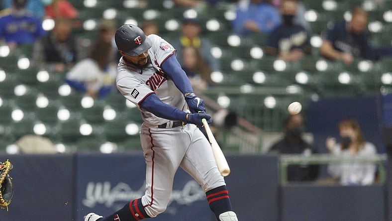 Apr 3, 2021; Milwaukee, Wisconsin, USA;  Minnesota Twins center fielder Byron Buxton (25) hits a home run against the Milwaukee Brewers during the seventh inning at American Family Field. Mandatory Credit: Jeff Hanisch-USA TODAY Sports