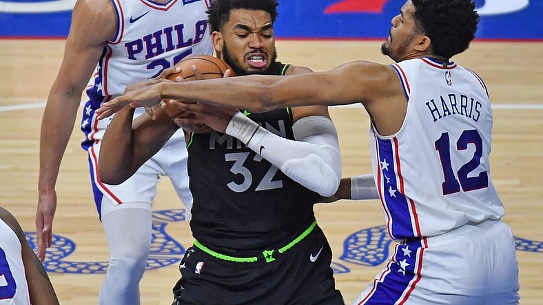 Apr 3, 2021; Philadelphia, Pennsylvania, USA; Minnesota Timberwolves center Karl-Anthony Towns (32) battles with Philadelphia 76ers forward Tobias Harris (12) during the second quarter at Wells Fargo Center. Mandatory Credit: Eric Hartline-USA TODAY Sports