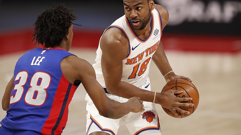 Apr 3, 2021; Detroit, Michigan, USA; New York Knicks guard Alec Burks (18) gets defended by Detroit Pistons guard Saben Lee (38) during the second quarter at Little Caesars Arena. Mandatory Credit: Raj Mehta-USA TODAY Sports