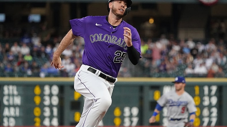 Apr 3, 2021; Denver, Colorado, USA; Colorado Rockies first baseman C.J. Cron (25) heads in to score a run against the Los Angeles Dodgers in the fourth inning at Coors Field. Mandatory Credit: Ron Chenoy-USA TODAY Sports