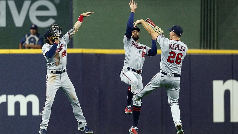 Apr 3, 2021; Milwaukee, Wisconsin, USA;  Minnesota Twins left fielder Jake Cave (60) and center fielder Byron Buxton (25) and right fielder Max Kepler (26) celebrate after defeating the Milwaukee Brewers at American Family Field. Mandatory Credit: Jeff Hanisch-USA TODAY Sports