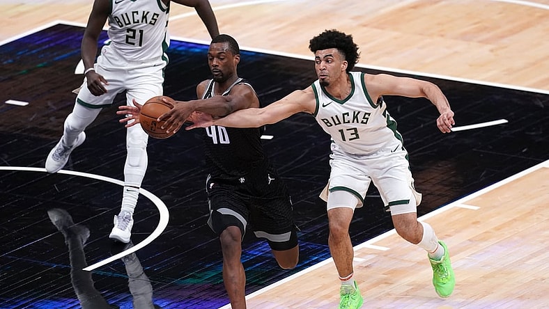 Apr 3, 2021; Sacramento, California, USA; Sacramento Kings forward Harrison Barnes (40) and Milwaukee Bucks forward Jordan Nwora (13) battle for a rebound in the second quarter at the Golden 1 Center. Mandatory Credit: Cary Edmondson-USA TODAY Sports