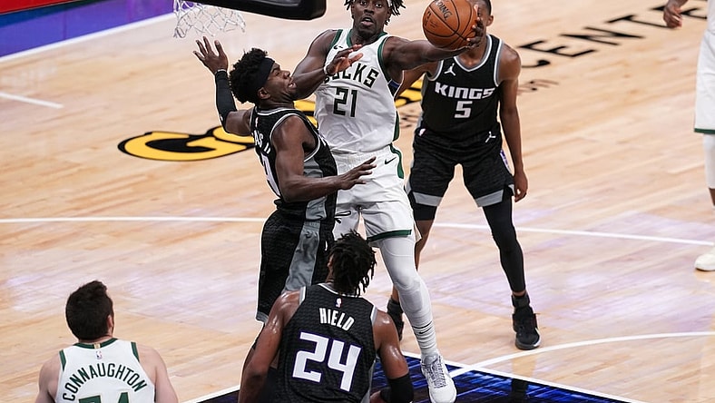 Apr 3, 2021; Sacramento, California, USA; Milwaukee Bucks guard Jrue Holiday (21) drives to the basket against the Sacramento Kings in the fourth quarter at the Golden 1 Center. Mandatory Credit: Cary Edmondson-USA TODAY Sports