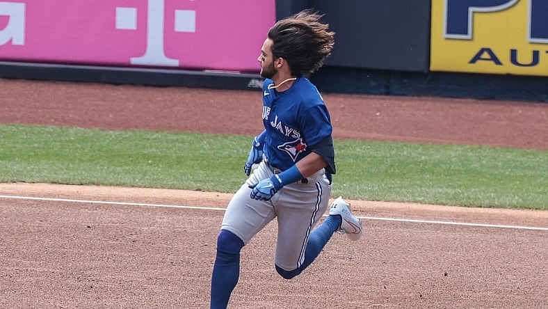 Apr 4, 2021; Bronx, New York, USA; Toronto Blue Jays shortstop Bo Bichette (11) runs to second base after hitting a double during the first inning against the New York Yankees at Yankee Stadium. Mandatory Credit: Vincent Carchietta-USA TODAY Sports