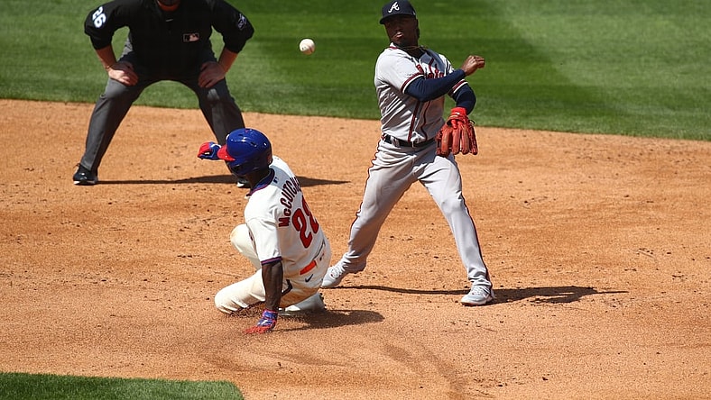Apr 4, 2021; Philadelphia, Pennsylvania, USA; Atlanta Braves second baseman Ozzie Albies (1) attempts to turn a double play over Philadelphia Phillies left fielder Andrew McCutchen (22) in the third inning at Citizens Bank Park. Mandatory Credit: Kyle Ross-USA TODAY Sports