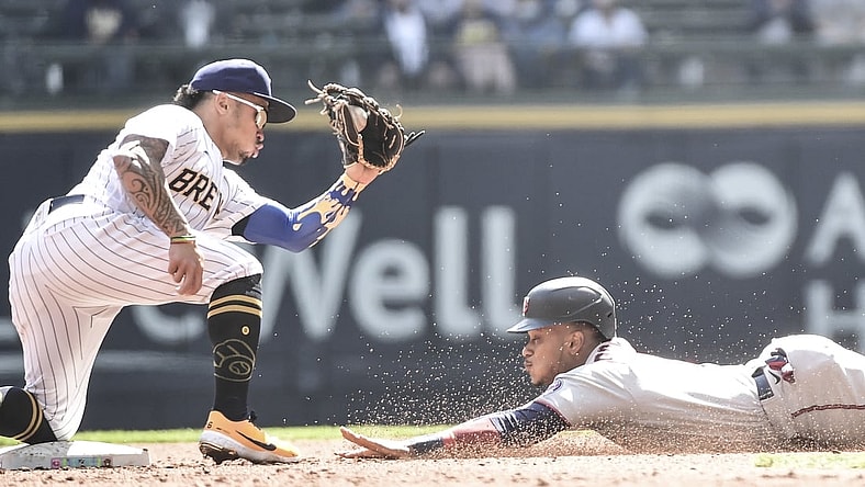 Apr 4, 2021; Milwaukee, Wisconsin, USA; Milwaukee Brewers second baseman Kolten Wong (16) gets ready to tag out Minnesota Twins second baseman Jorge Polanco (11) trying to steal 2nd base in the third inning at American Family Field. Mandatory Credit: Benny Sieu-USA TODAY Sports