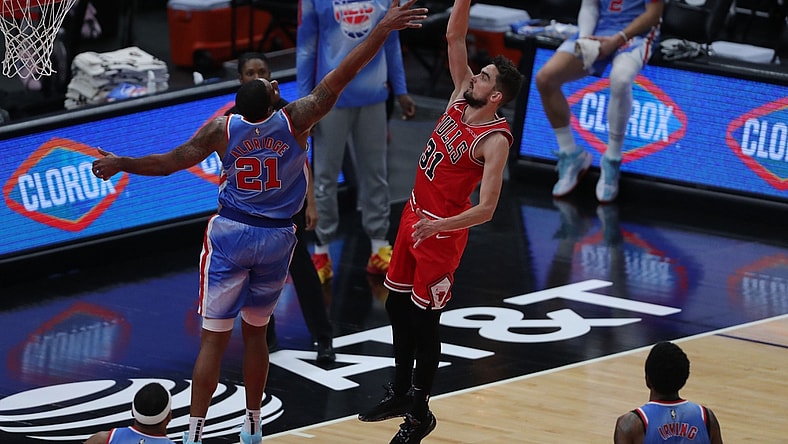 Apr 4, 2021; Chicago, Illinois, USA; Chicago Bulls guard Tomas Satoransky (31) scores over Brooklyn Nets center LaMarcus Aldridge (21) during the third quarter at the United Center. Mandatory Credit: Dennis Wierzbicki-USA TODAY Sports