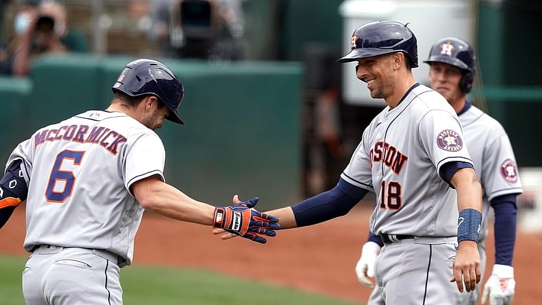 Apr 4, 2021; Oakland, California, USA; Houston Astros left fielder Chas McCormick (6) receives congratulations from catcher Jason Castro (18) after hitting a home run during the sixth inning against the Oakland Athletics at RingCentral Coliseum. Mandatory Credit: Darren Yamashita-USA TODAY Sports